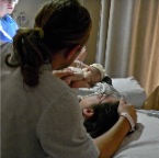 Michael & Amber getting there first look at baby Daniel.